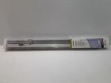 a tube of toothbrush sitting on a white surface
