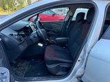 the interior of a car with the door open showing the driver ' s seat