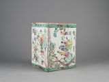 chinese famille vase with birds and flowers in a landscape