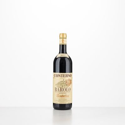 a bottle of red wine sitting on top of a table