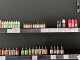many bottles of liquid on the shelves in the store
