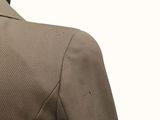 a close up of a man wearing a suit and tie