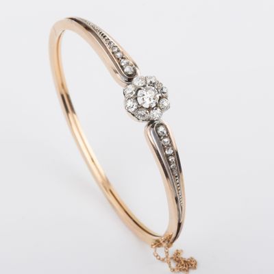 an image of a gold and diamond bang bracelet