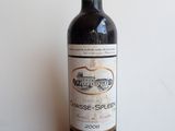 a bottle of wine that is sitting on a table