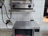 a toaster oven sitting on top of a counter in a kitchen