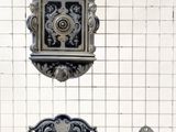 three decorative objects hanging on the wall in the room