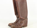 pair of brown leather cowboy boots on a white background