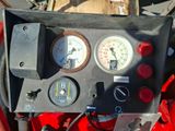 a close up of a control panel with gauges on it