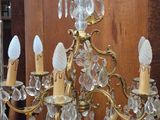 a chandelier that has a lot of crystal hanging from it