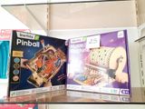 two boxes that are sitting on a shelf in a store