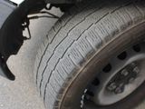 a close up of a flat tire on a truck