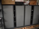 a large metal cabinet in the middle of a room