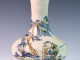 a vase that has a picture of a boat on it