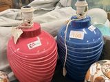 three vases sitting on a table next to each other