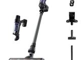 a close up of a cordless vacuum cleaner and accessories on a white background