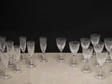 a lot of wine glasses sitting on a table