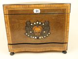 an image of a wooden box with a decorative design on it