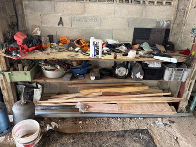 a workbench that has a lot of wood on it