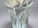 a glass vase that is sitting on a table
