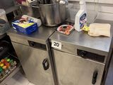 stainless steel counter top in a commercial kitchen with pots and pans on it