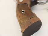 a close up of a wooden gun on a table