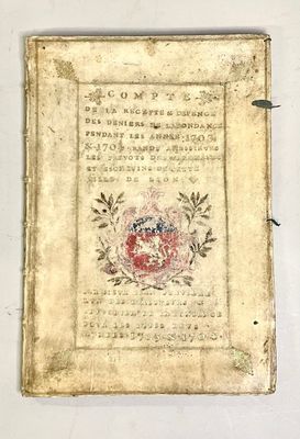 an old book with writing on it sitting on top of a table
