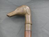 a wooden stick with a horse head on it