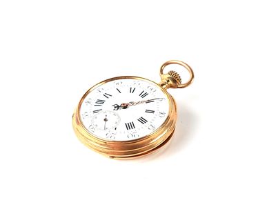 a gold pocket watch with roman numerals on it