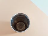 a cup of coffee that is sitting on a table