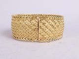 a gold bracelet with a chain link and a clasp