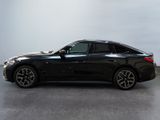 the bmw 6 series sedan is parked in a large room