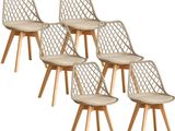 set of four chairs with wooden legs and a beige seat