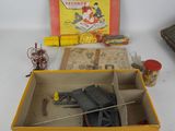 a box with a toy gun in it and a box with a toy gun in it