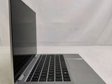 an open laptop computer sitting on top of a white table