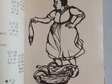 a book with a drawing of a woman holding a fish