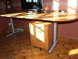 an image of a desk with a computer on top of it