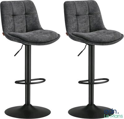 a pair of grey bar stools with black metal legs