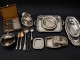 an assortment of silverware including spoons, bowls, and spoons