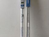two pens sitting next to each other on a table