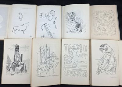 six livres illustrés posés sur une surface noire