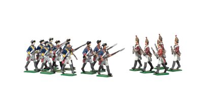 several figurines of men in uniforms are lined up in a line