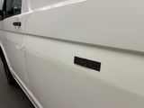 a close up of a white truck with a black sticker on it