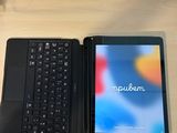 a tablet and a laptop sitting on a desk next to each other