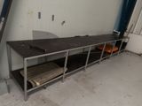 a metal shelf that has a bunch of books on it
