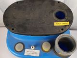 an image of a blue and black toilet with a blue lid