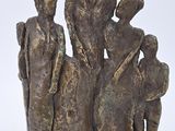 statue of a group of people with a child and a dog