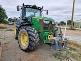 a tractor that is parked in the dirt