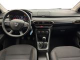 the interior of a car with a steering wheel, dashboard, and dashboard controls