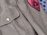 a close up of a military uniform with a tie