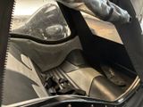 a close up of the inside of a car with the door open